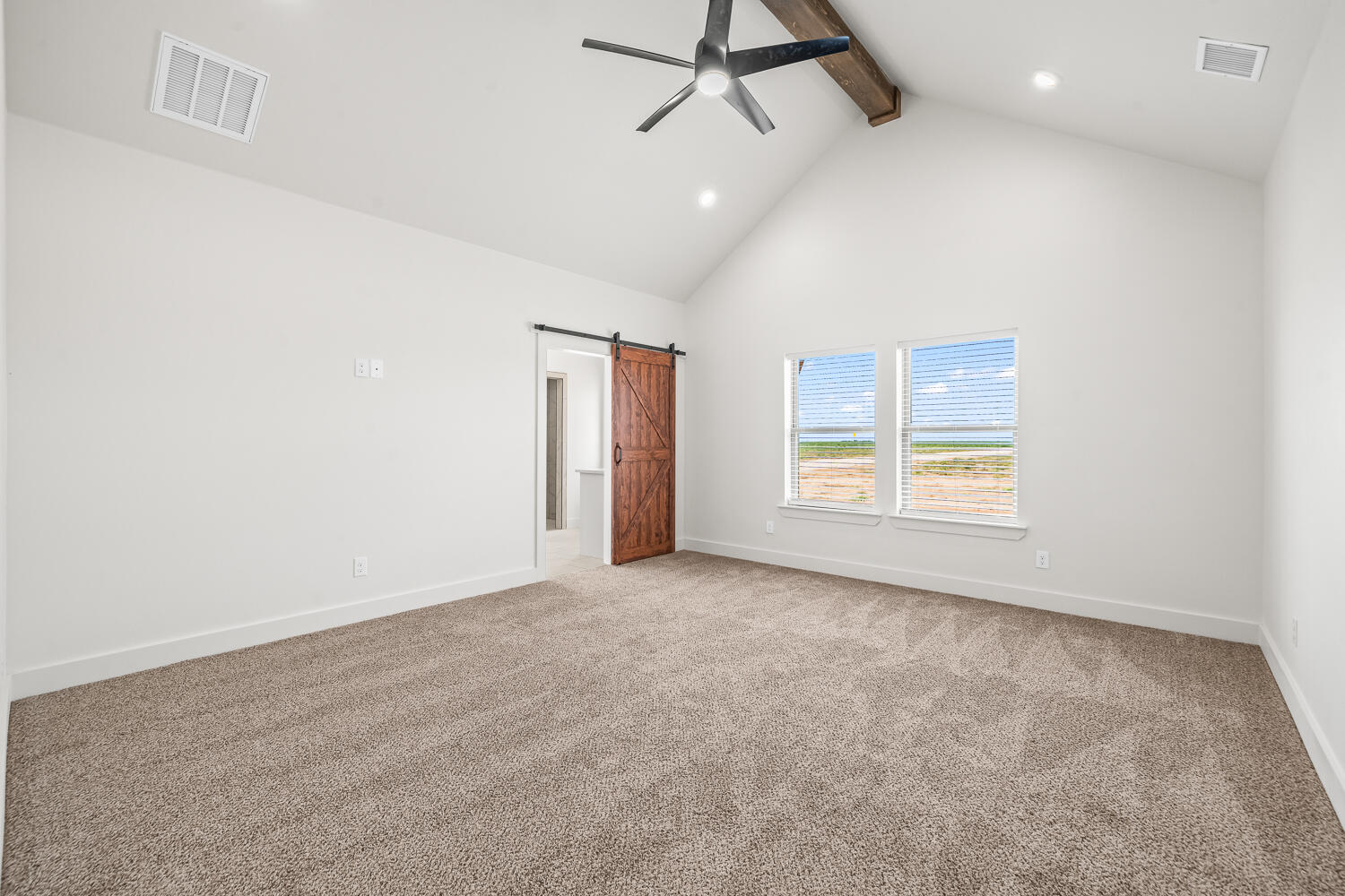 7205 East F M 41 Slaton, TX 79364 - Photo 6 of 47 an empty room with windows and ceiling fan