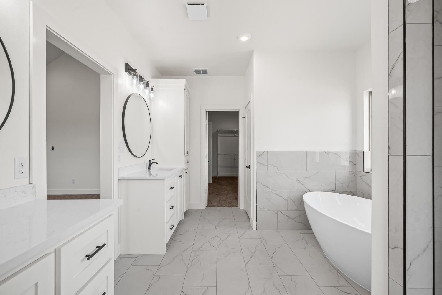 7205 East F M 41 Slaton, TX 79364 - Photo 9 of 47 a spacious bathroom with a toilet a sink and a mirror