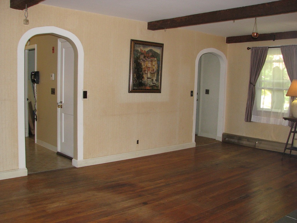 1 Lake Road Ashburnham, MA 01430 - Photo 4 of 14 an empty room with wooden floor and windows