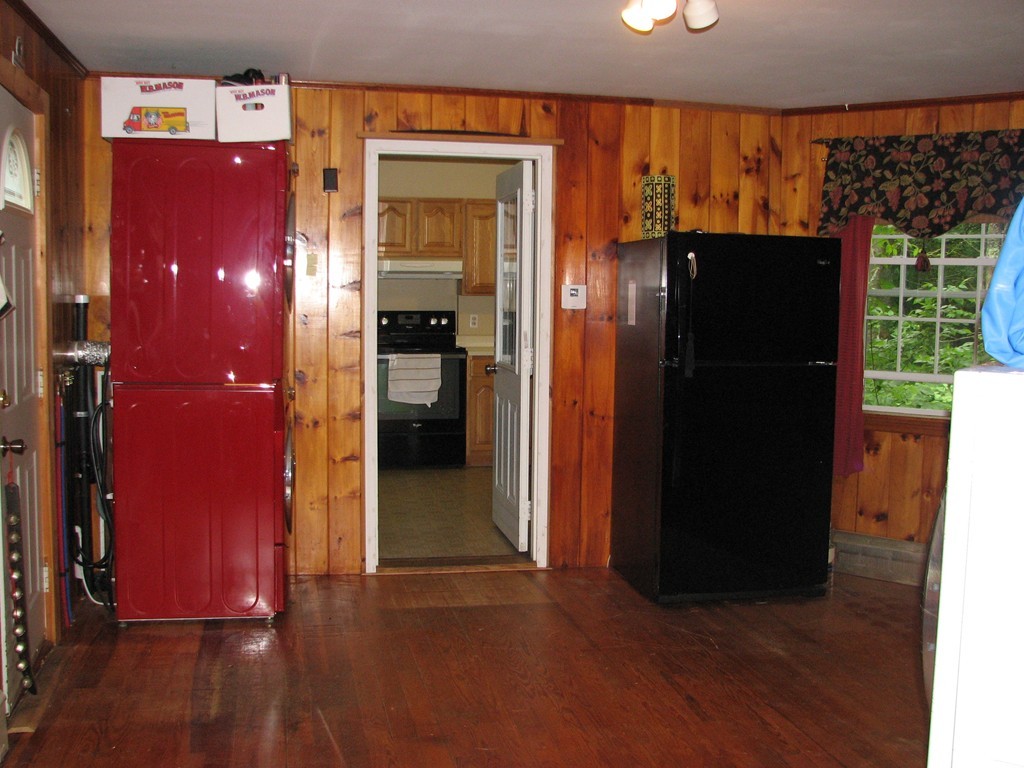 1 Lake Road Ashburnham, MA 01430 - Photo 9 of 14 an empty room with wooden floor and windows