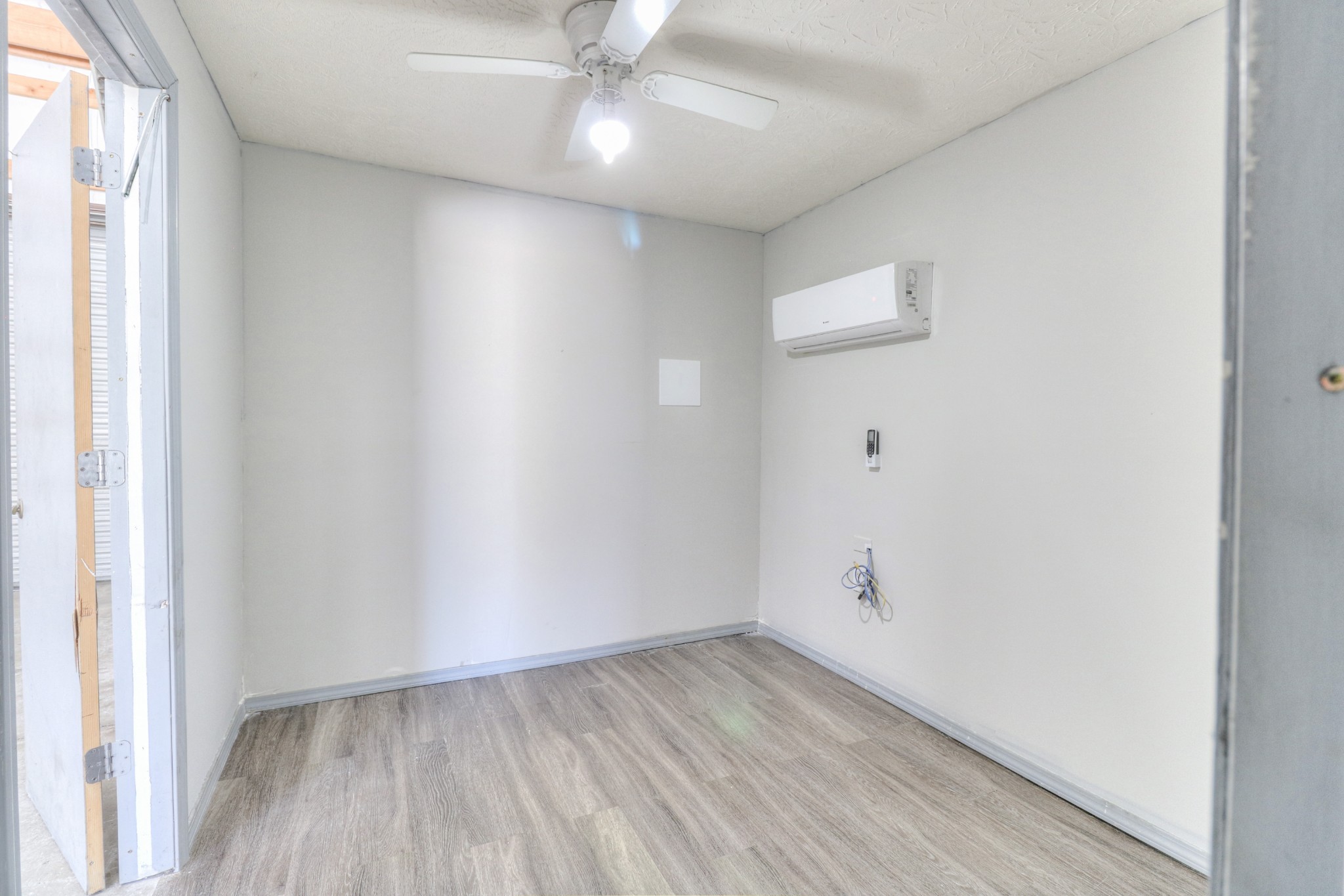 4437 Hickerson Road Manchester, TN 37355 - Photo 14 of 27 an empty room with a window and wooden floor