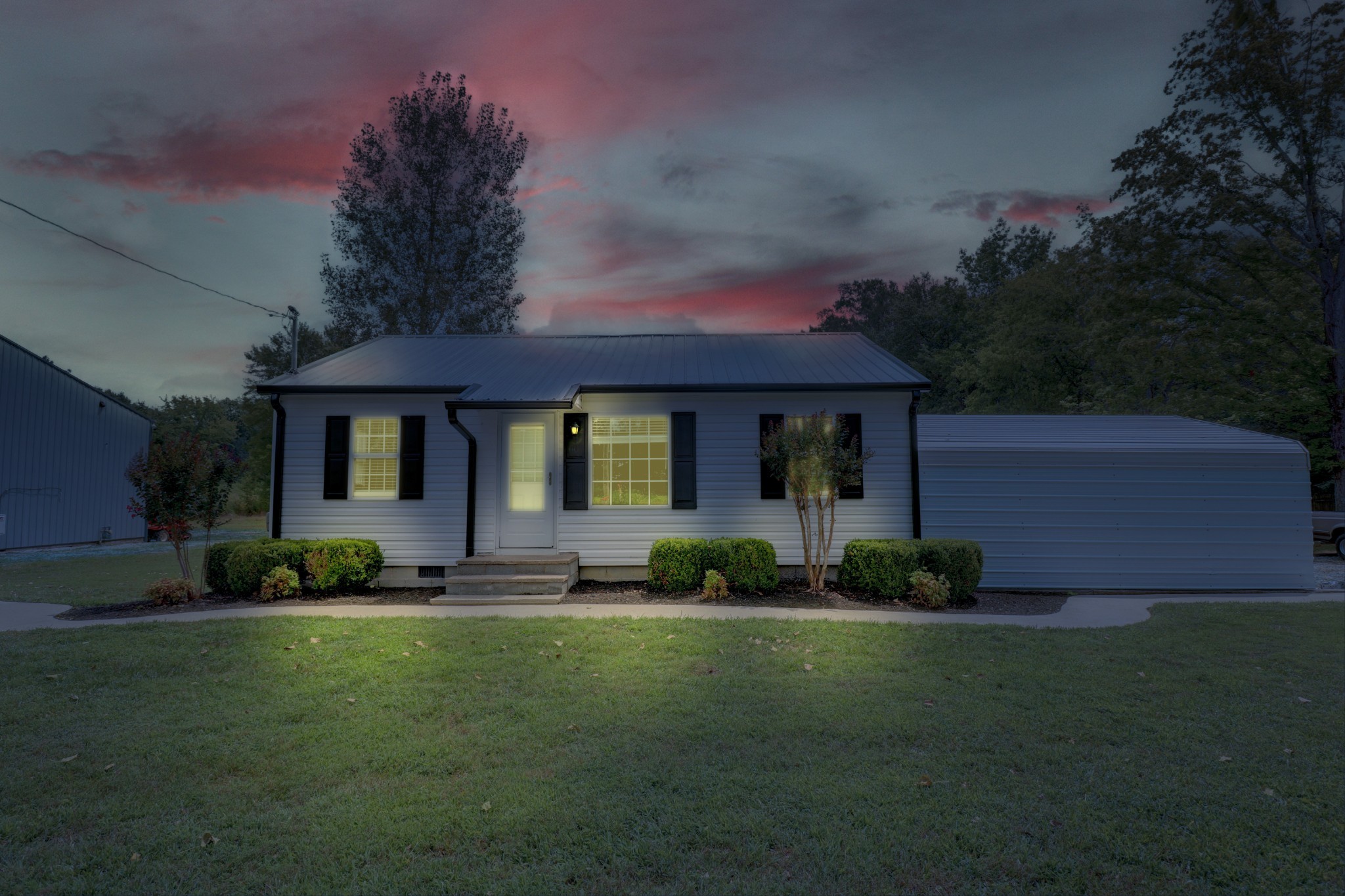 4437 Hickerson Road Manchester, TN 37355 - Photo 18 of 27 a front view of a house with a garden