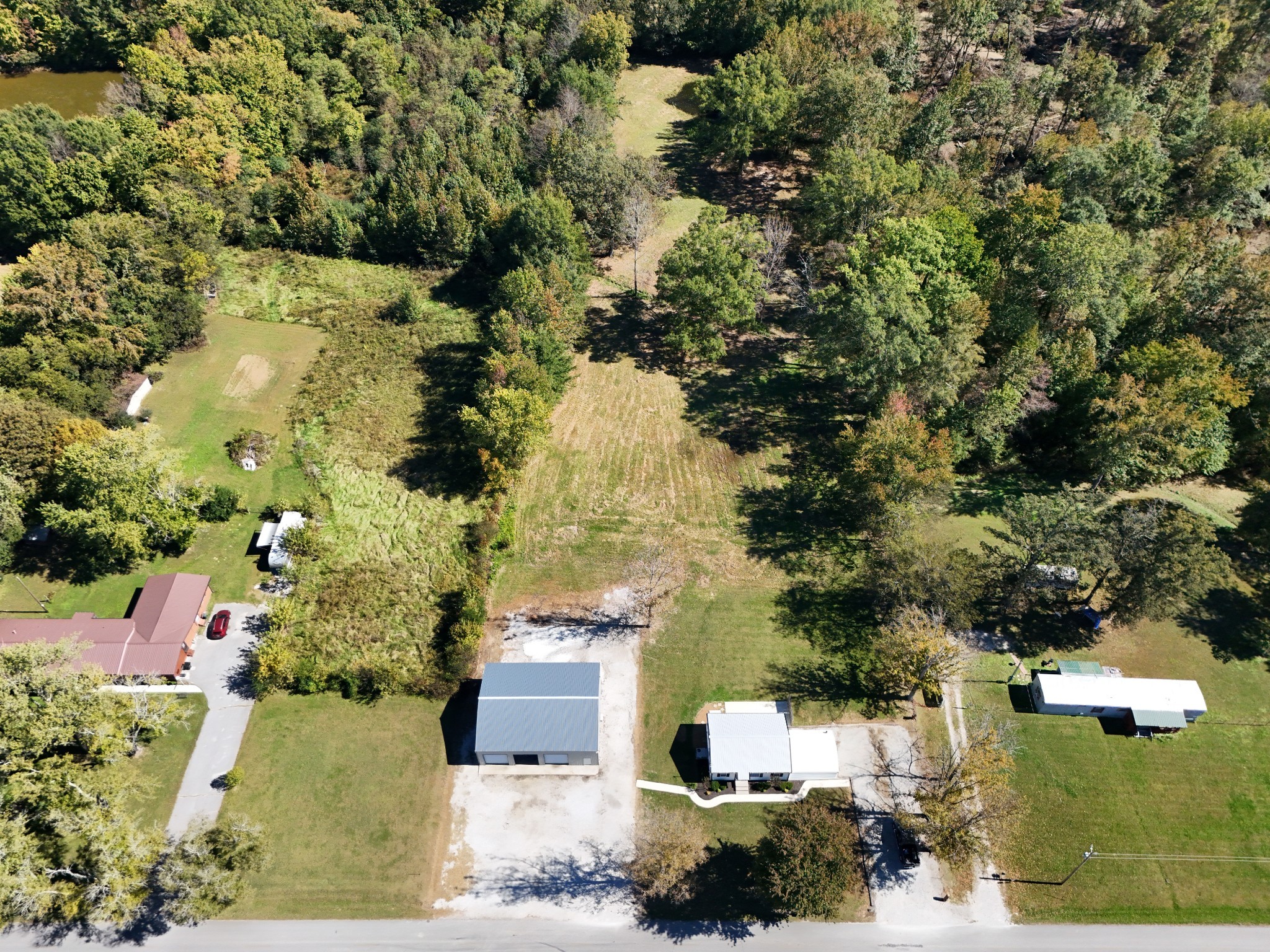 4437 Hickerson Road Manchester, TN 37355 - Photo 25 of 27 an aerial view of residential houses with outdoor space