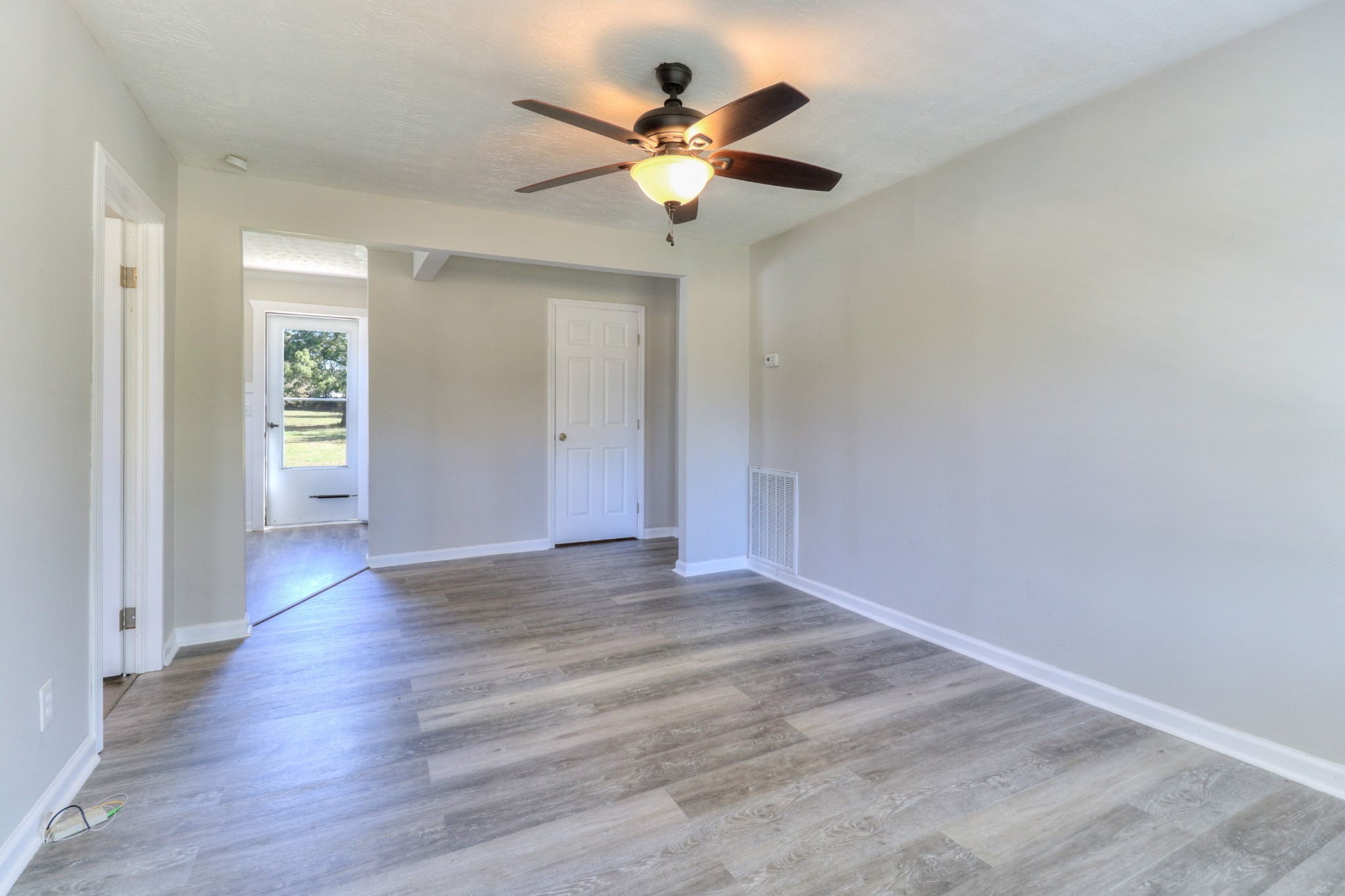 4437 Hickerson Road Manchester, TN 37355 - Photo 7 of 27 a view of an empty room with wooden floor