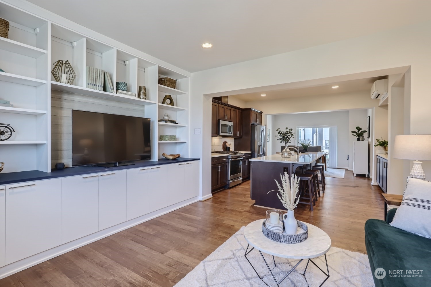 3270 Southwest Graham Street, Unit 502 Seattle, WA 98126 - Photo 1 of 32 a living room with furniture or chandelier and a wooden floor