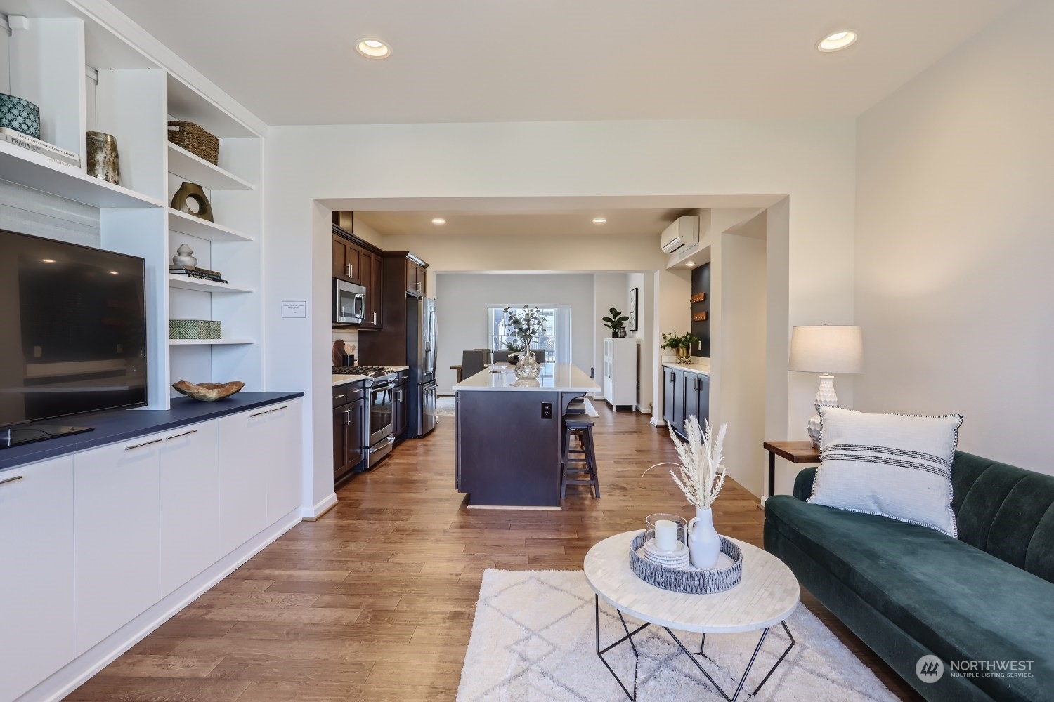 3270 Southwest Graham Street, Unit 502 Seattle, WA 98126 - Photo 13 of 32 a living room with furniture and a flat screen tv