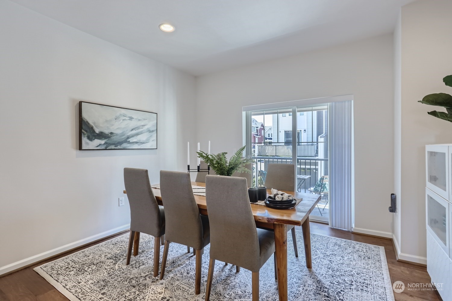 3270 Southwest Graham Street, Unit 502 Seattle, WA 98126 - Photo 14 of 32 a view of a dining room with furniture window and wooden floor