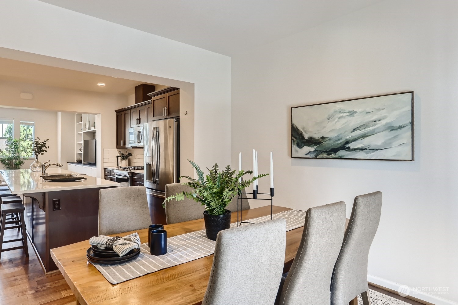 3270 Southwest Graham Street, Unit 502 Seattle, WA 98126 - Photo 16 of 32 a view of a dining room with furniture window and wooden floor