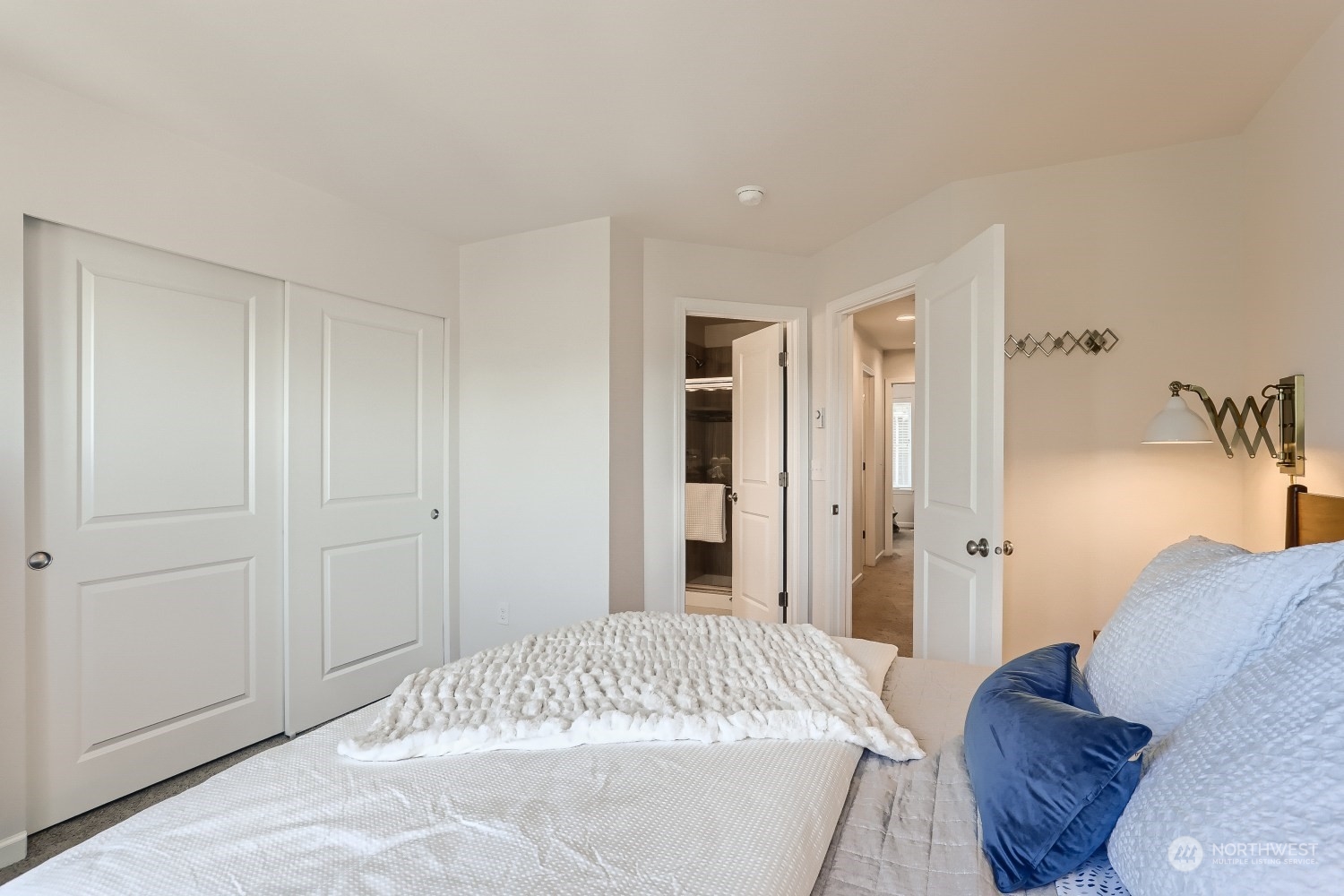 3270 Southwest Graham Street, Unit 502 Seattle, WA 98126 - Photo 19 of 32 a bedroom with a bed and a couch