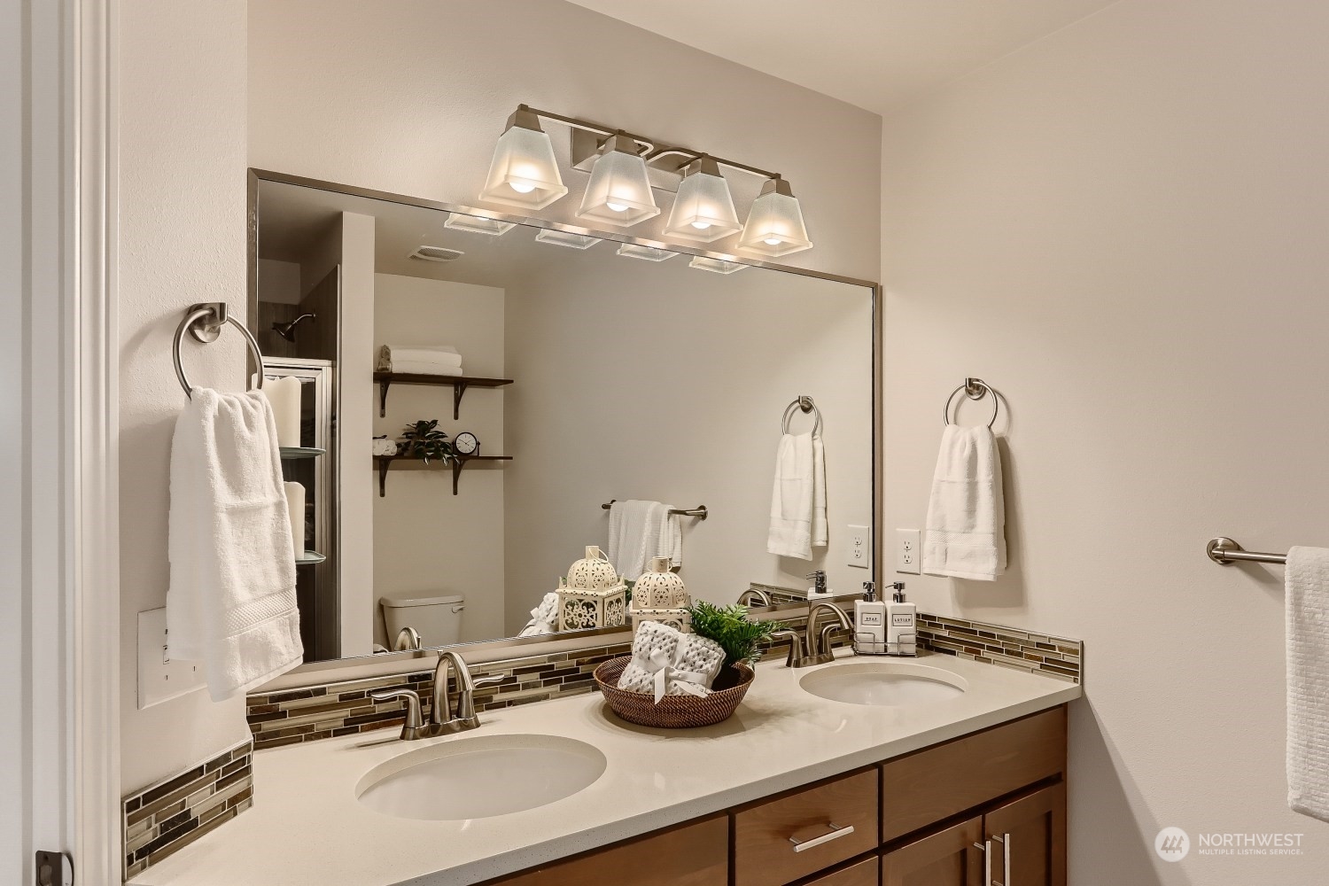 3270 Southwest Graham Street, Unit 502 Seattle, WA 98126 - Photo 20 of 32 a bathroom with a double vanity sink and a mirror