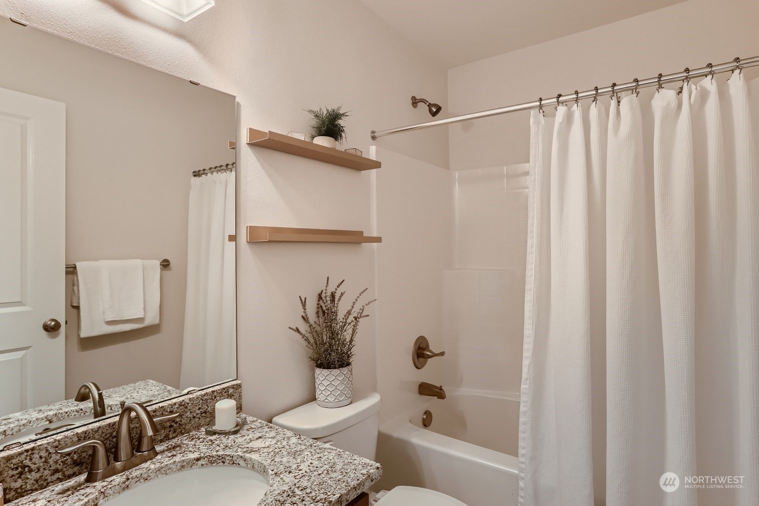 3270 Southwest Graham Street, Unit 502 Seattle, WA 98126 - Photo 23 of 32 a bathroom with a sink toilet and shower