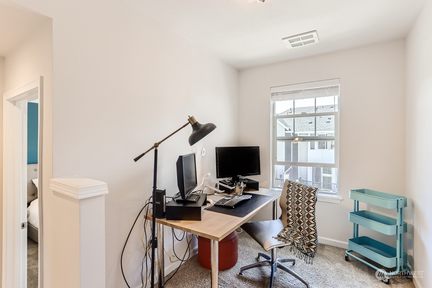 3270 Southwest Graham Street, Unit 502 Seattle, WA 98126 - Photo 25 of 32 a view of a workspace with furniture and a window