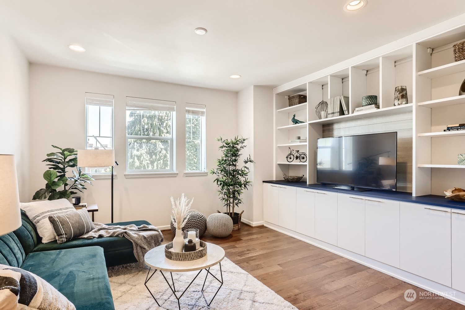 3270 Southwest Graham Street, Unit 502 Seattle, WA 98126 - Photo 3 of 32 a living room with furniture and a flat screen tv