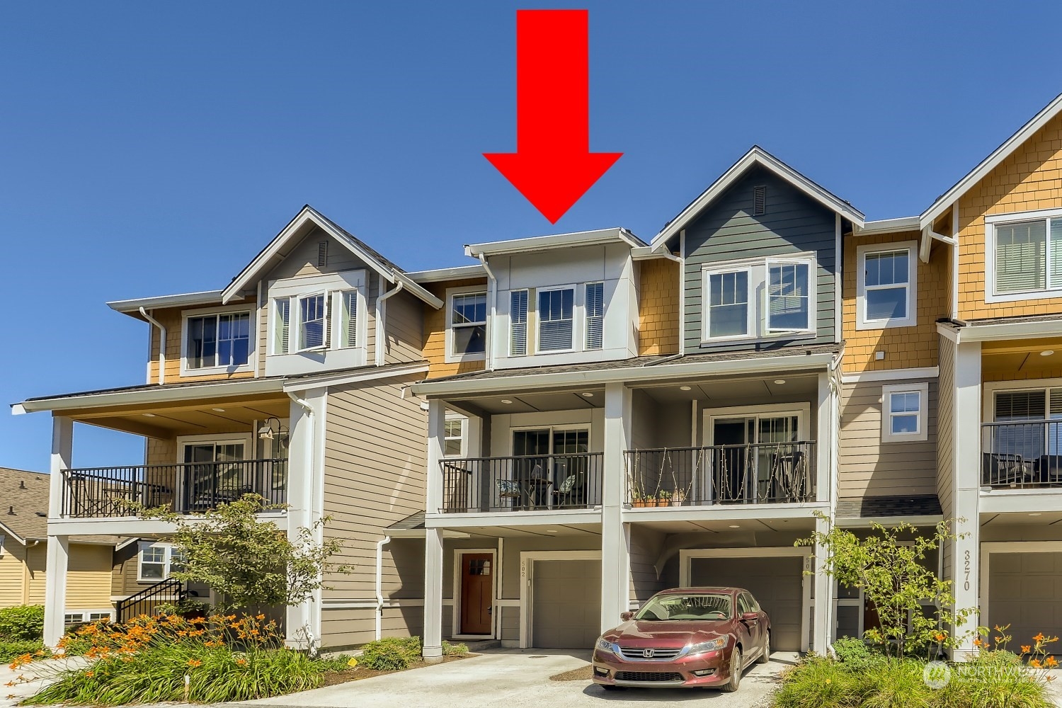 3270 Southwest Graham Street, Unit 502 Seattle, WA 98126 - Photo 32 of 32 a front view of a house with a yard