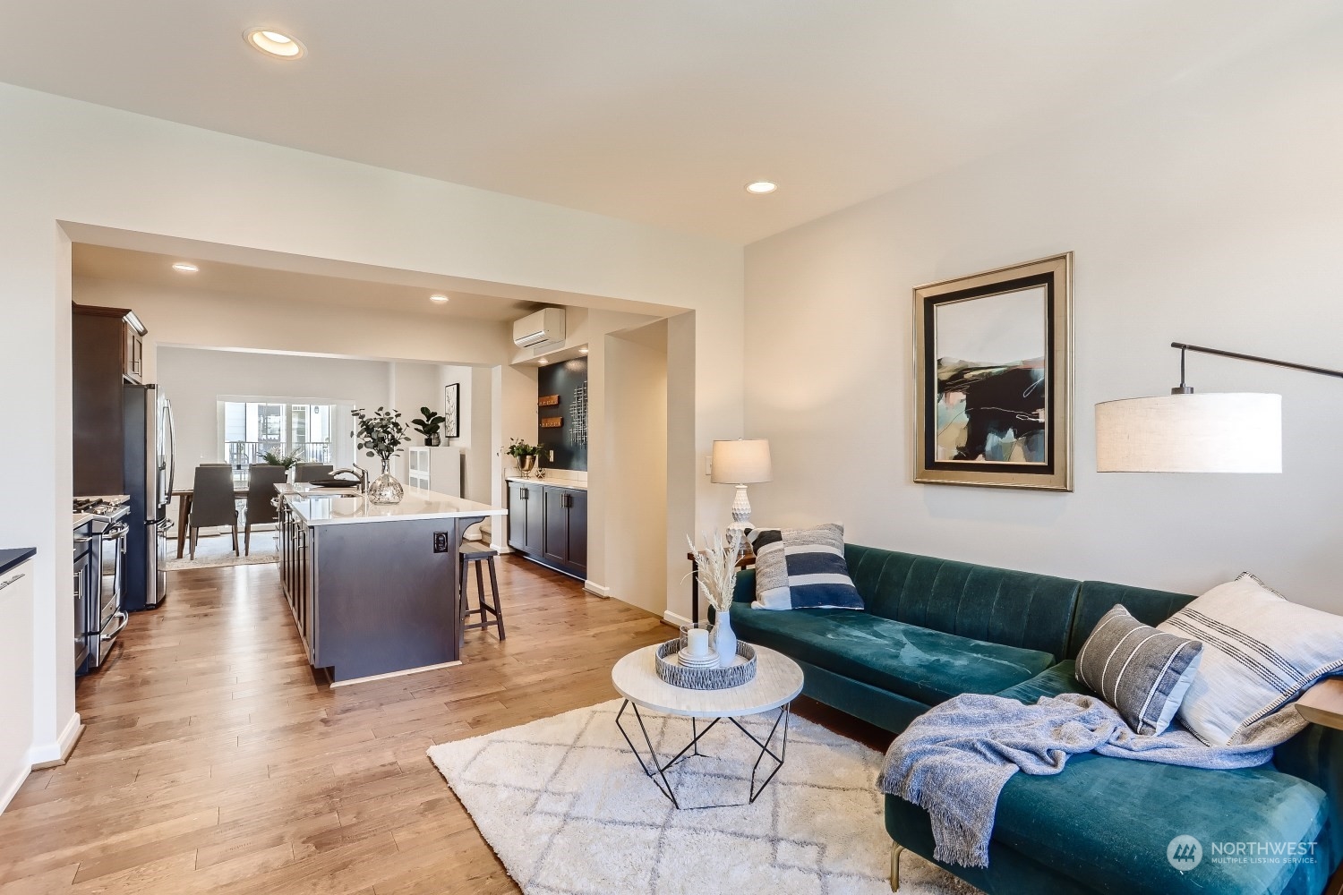 3270 Southwest Graham Street, Unit 502 Seattle, WA 98126 - Photo 4 of 32 a living room with furniture and wooden floor