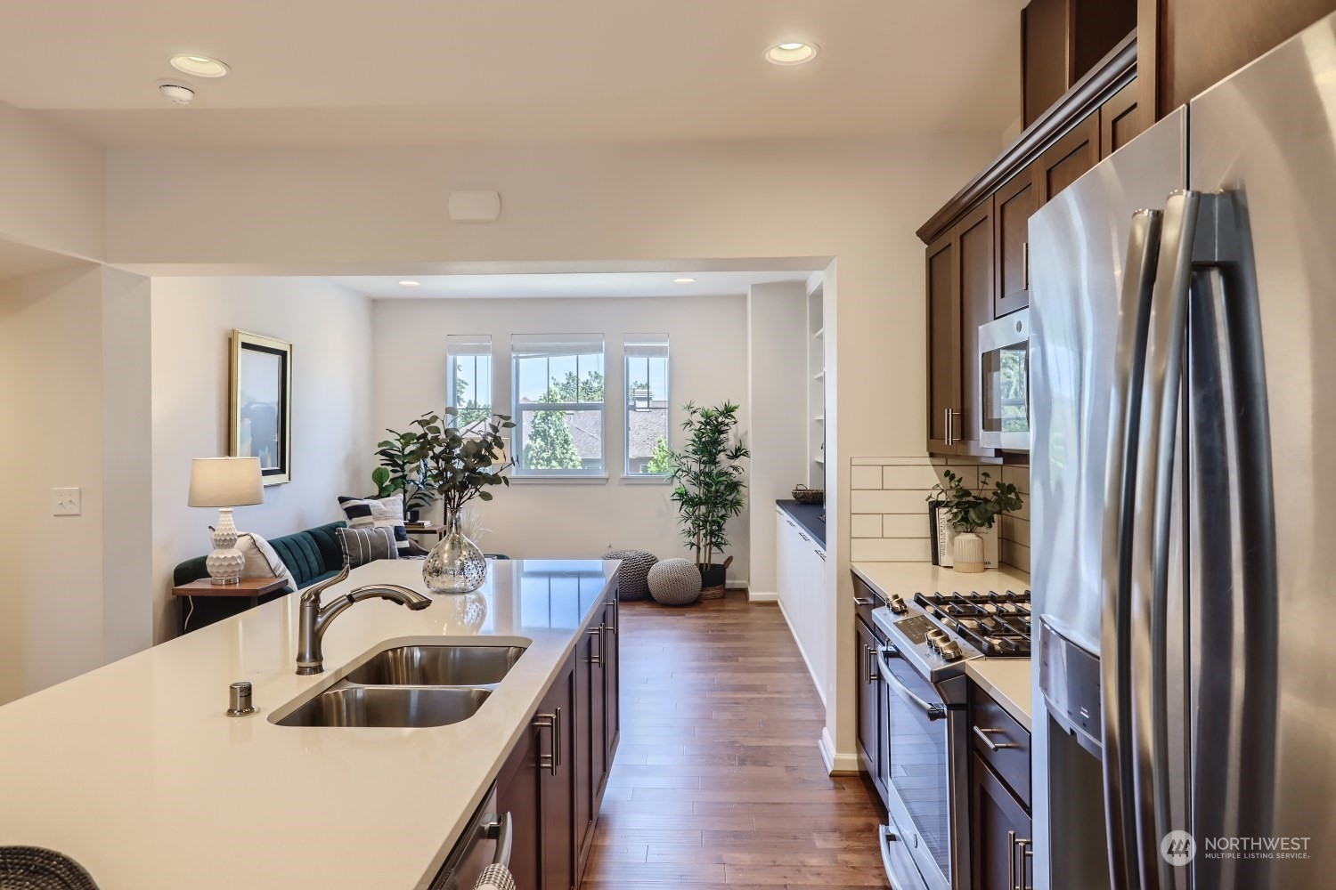 3270 Southwest Graham Street, Unit 502 Seattle, WA 98126 - Photo 8 of 32 a kitchen with sink refrigerator and microwave