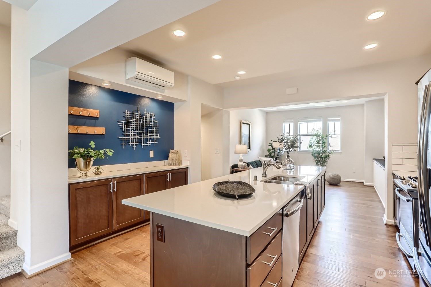 3270 Southwest Graham Street, Unit 502 Seattle, WA 98126 - Photo 9 of 32 a kitchen with a sink a stove and chairs