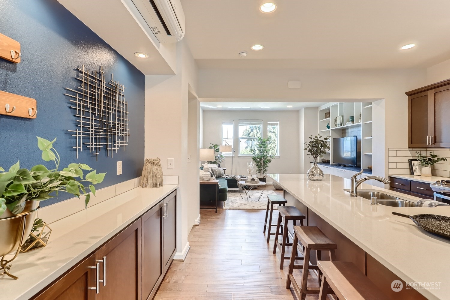 3270 Southwest Graham Street, Unit 502 Seattle, WA 98126 - Photo 10 of 32 a large kitchen with kitchen island granite countertop a large counter top a sink a stove and a dining table
