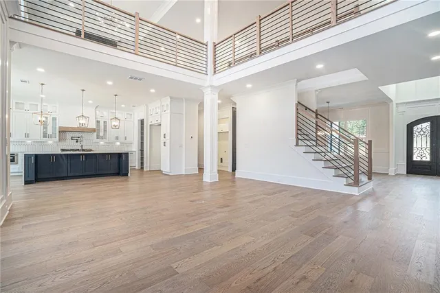 a view of a kitchen with a sink and an entryway
