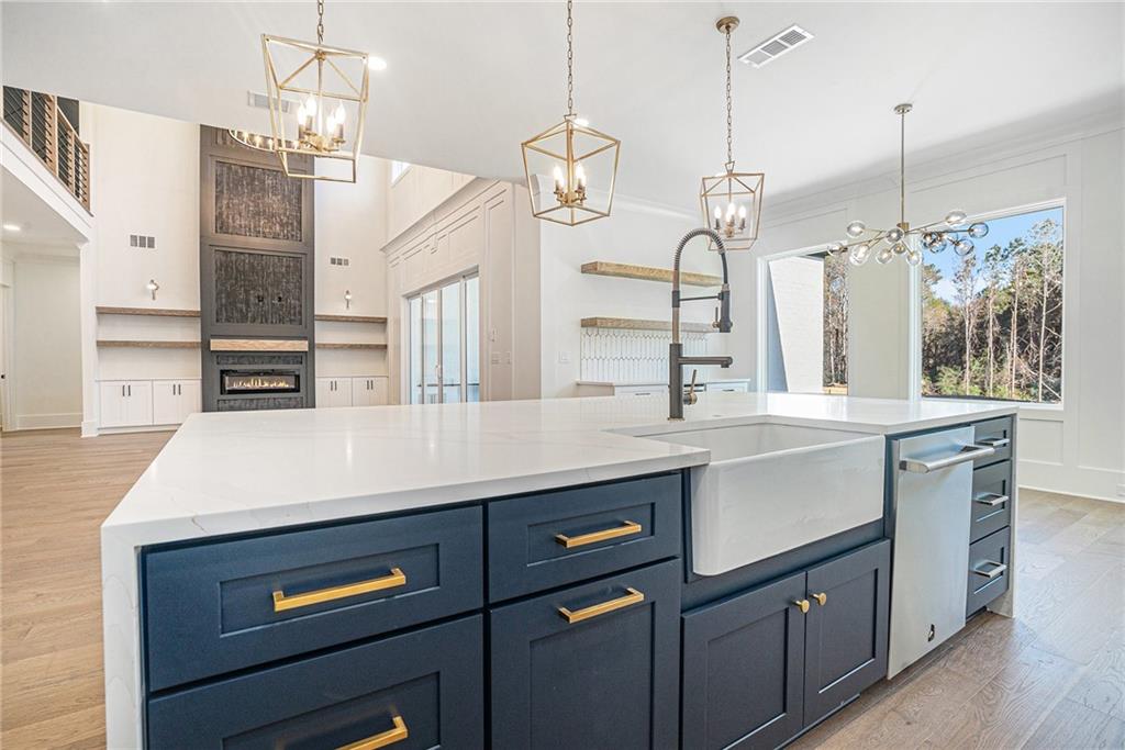5745 Union Church Road Braselton, GA 30517 - Photo 7 of 16 a kitchen with a sink a counter space cabinets and appliances