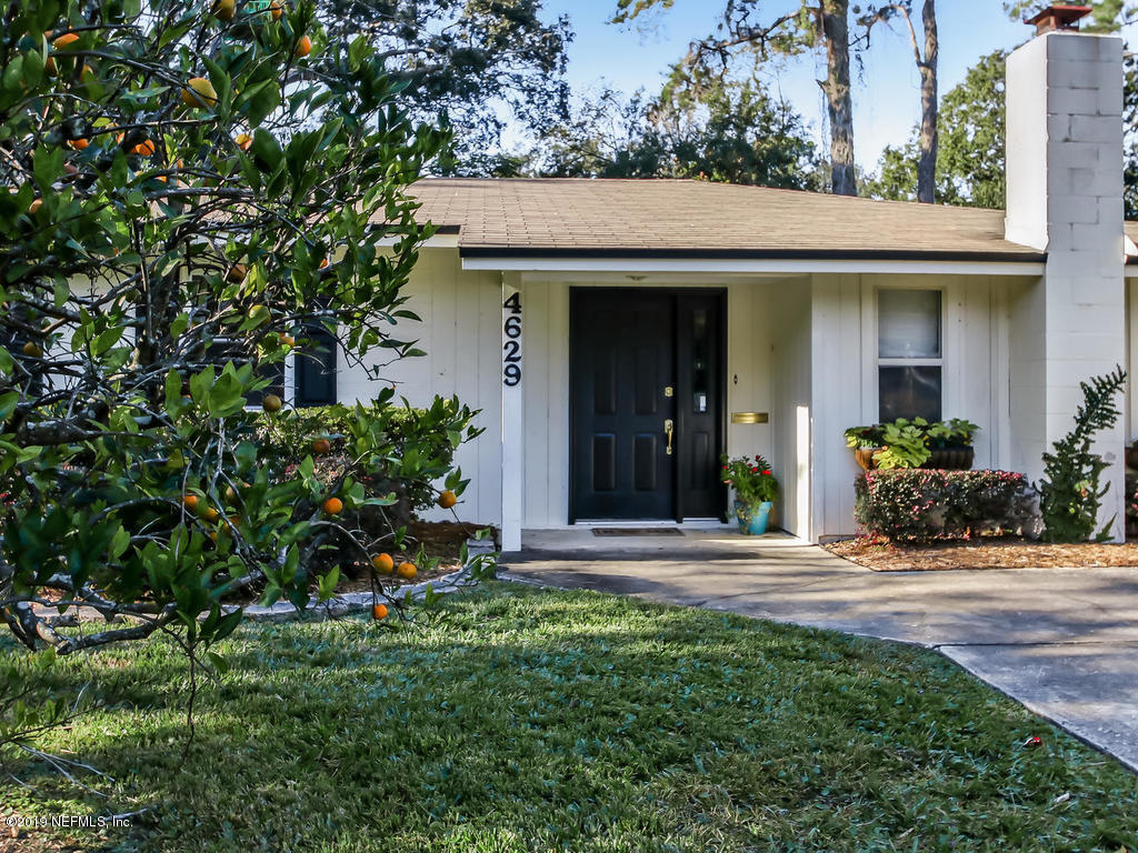 4629 Homestead Road Jacksonville, FL 32210 - Photo 1 of 27 front view of a house with a yard