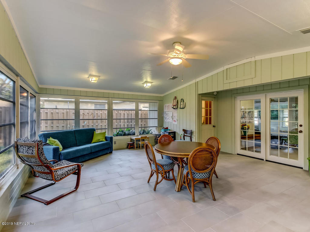 4629 Homestead Road Jacksonville, FL 32210 - Photo 13 of 27 a living room with furniture and a large window