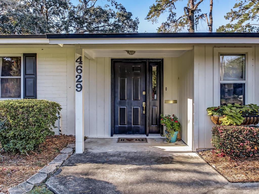 4629 Homestead Road Jacksonville, FL 32210 - Photo 15 of 27 front view of a house with potted plants