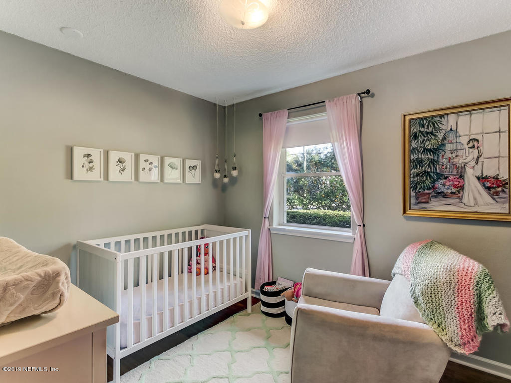 4629 Homestead Road Jacksonville, FL 32210 - Photo 19 of 27 a bedroom with furniture and a window