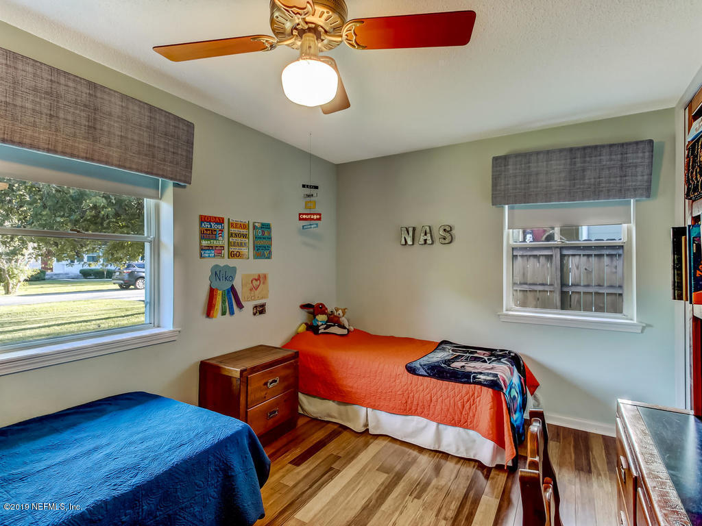 4629 Homestead Road Jacksonville, FL 32210 - Photo 21 of 27 a bedroom with furniture and a window