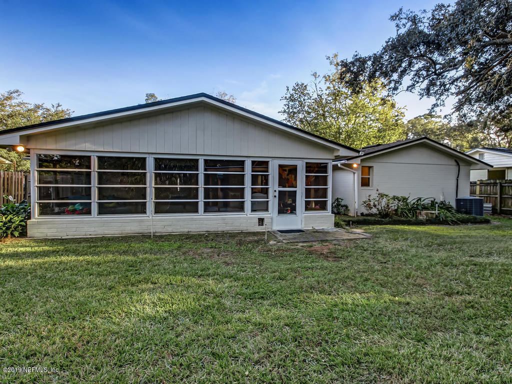 4629 Homestead Road Jacksonville, FL 32210 - Photo 24 of 27 a front view of a house with a garden