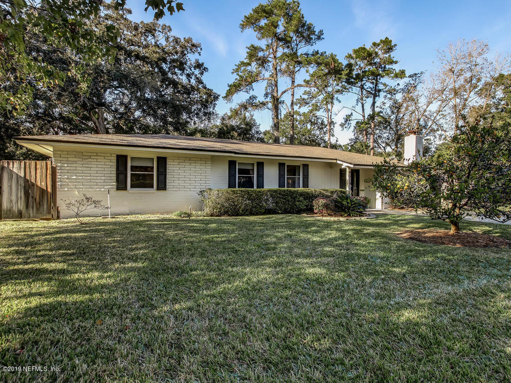 4629 Homestead Road Jacksonville, FL 32210 - Photo 26 of 27 a front view of house with yard and green space