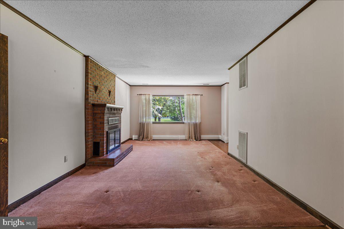 6912 Highbridge Road Bowie, MD 20720 - Photo 6 of 42 Living Room w/ fireplace