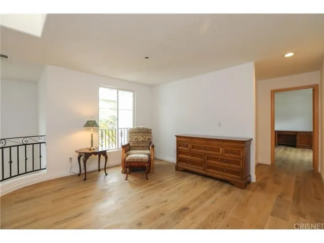 a room with furniture and a wooden floor