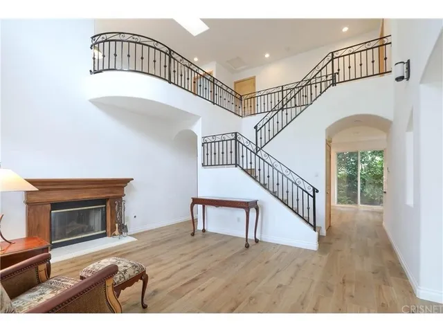 a view of entryway wooden floor and a rug