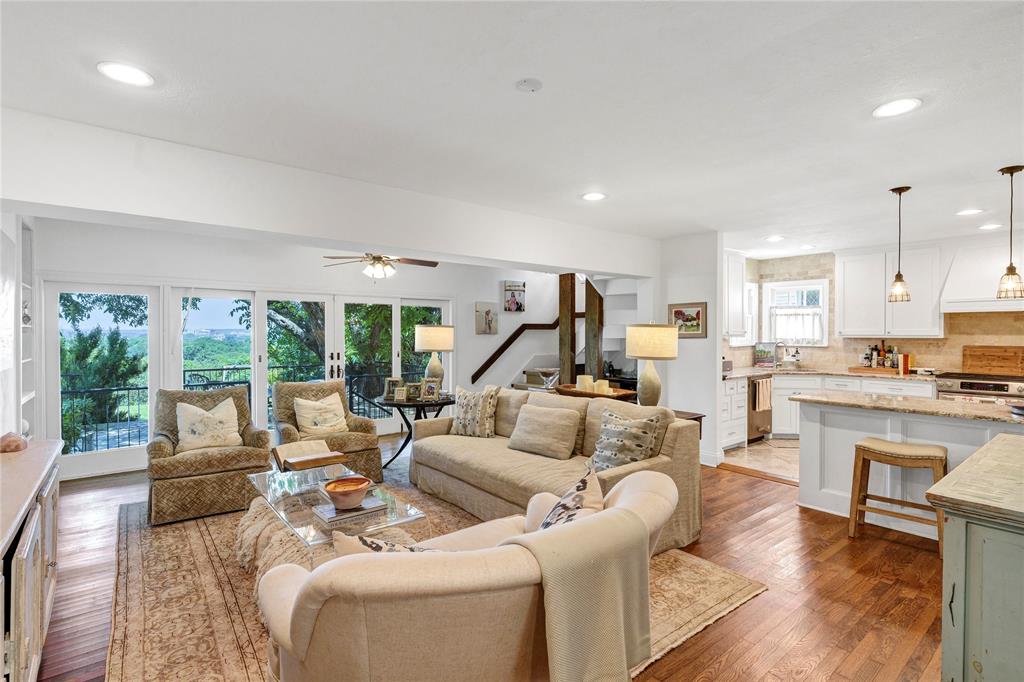 3170 Westcliff Road West Fort Worth, TX 76109 - Photo 12 of 39 a living room with furniture kitchen view and a wooden floor