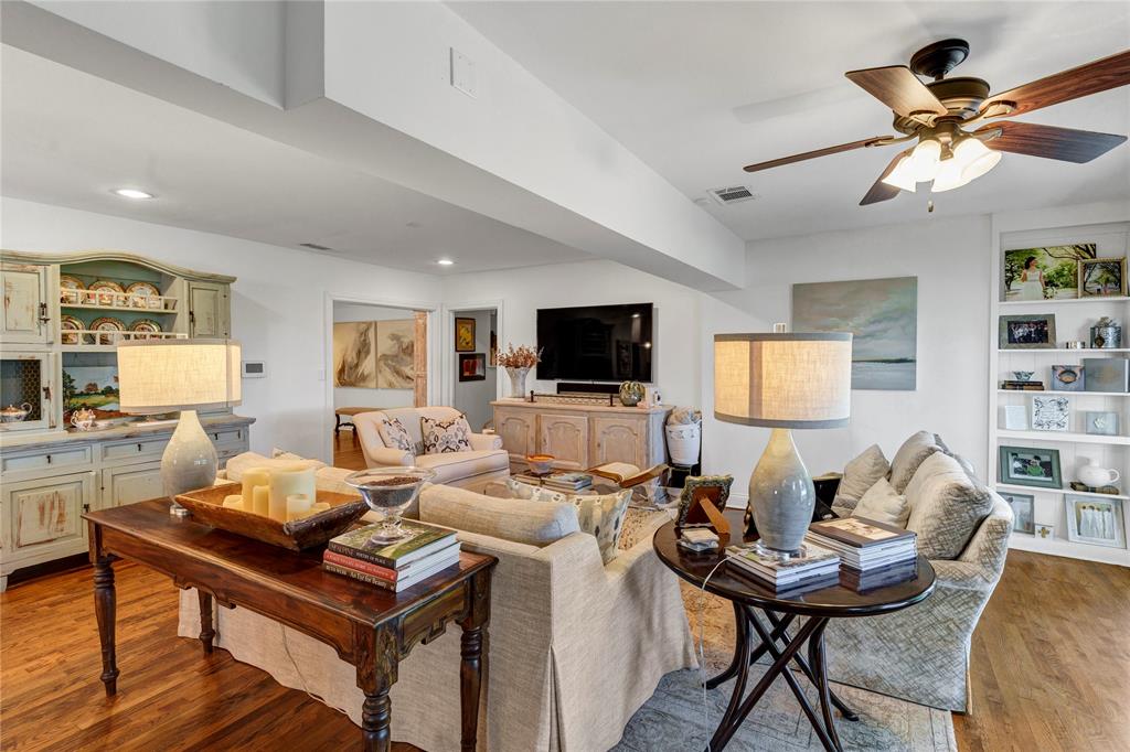 3170 Westcliff Road West Fort Worth, TX 76109 - Photo 13 of 39 a living room with furniture a flat screen tv and kitchen view