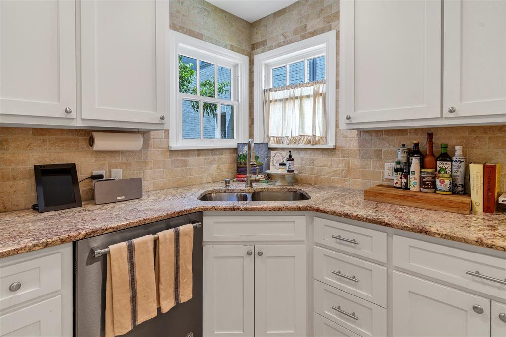 3170 Westcliff Road West Fort Worth, TX 76109 - Photo 18 of 39 a kitchen with granite countertop white cabinets and white appliances