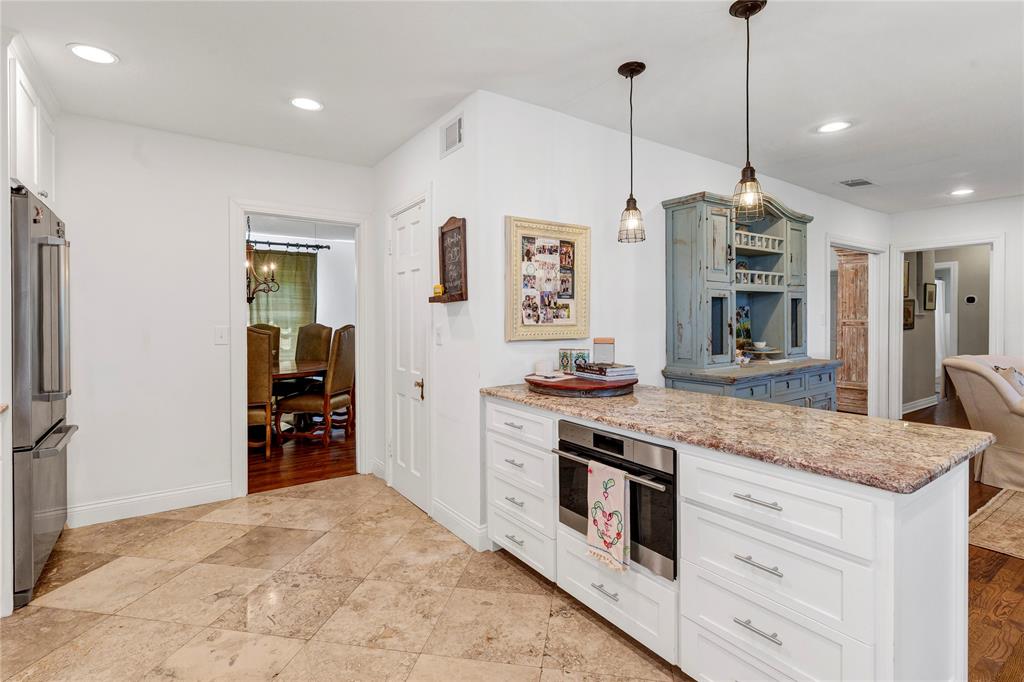 3170 Westcliff Road West Fort Worth, TX 76109 - Photo 19 of 39 a kitchen with stainless steel appliances granite countertop a stove and a refrigerator