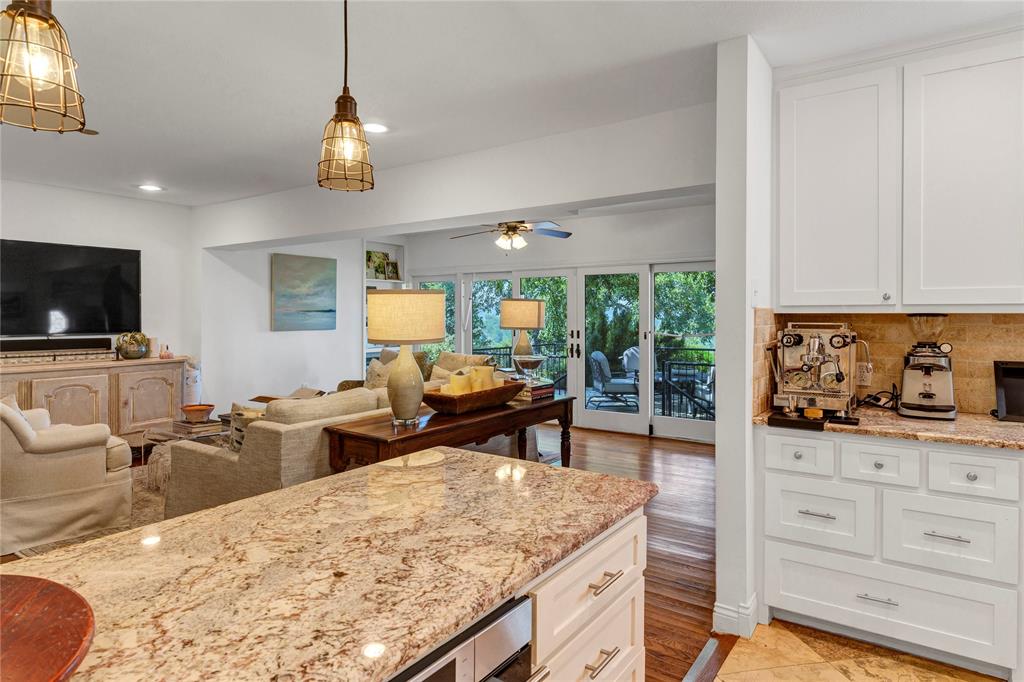 3170 Westcliff Road West Fort Worth, TX 76109 - Photo 20 of 39 a living room with furniture a flat screen tv and kitchen view