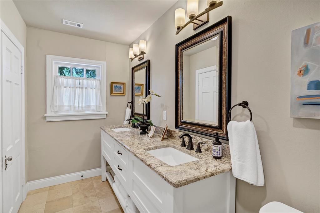 3170 Westcliff Road West Fort Worth, TX 76109 - Photo 27 of 39 a bathroom with a granite countertop sink and a mirror