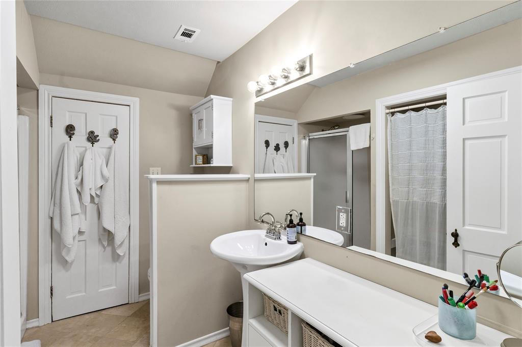 3170 Westcliff Road West Fort Worth, TX 76109 - Photo 31 of 39 a bathroom with a sink vanity and a mirror