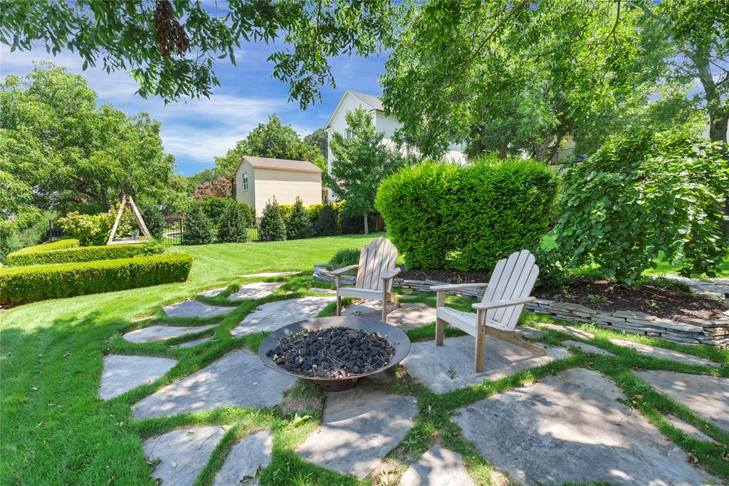 3170 Westcliff Road West Fort Worth, TX 76109 - Photo 34 of 39 a view of a chairs and table in backyard