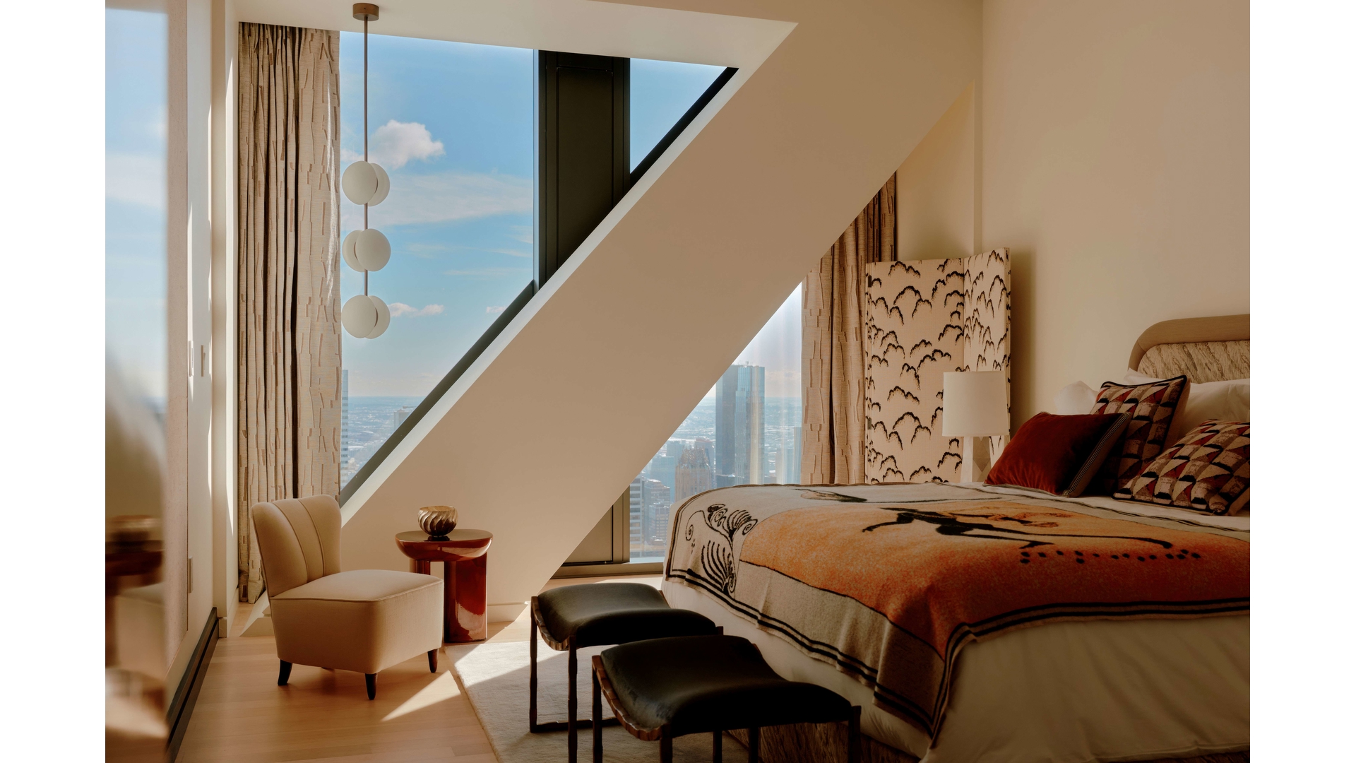 53 West 53rd Street, Unit 66 Manhattan, NY 10019 - Photo 12 of 15 a bedroom with bed and furniture