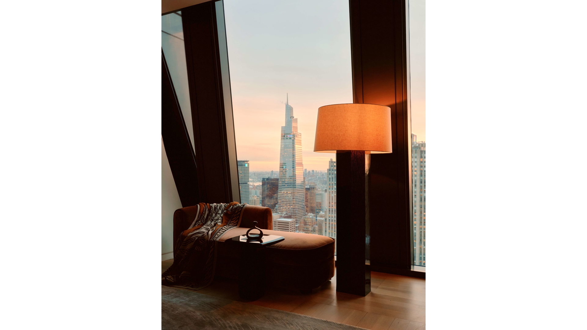 53 West 53rd Street, Unit 66 Manhattan, NY 10019 - Photo 14 of 15 a room with a window and a chair