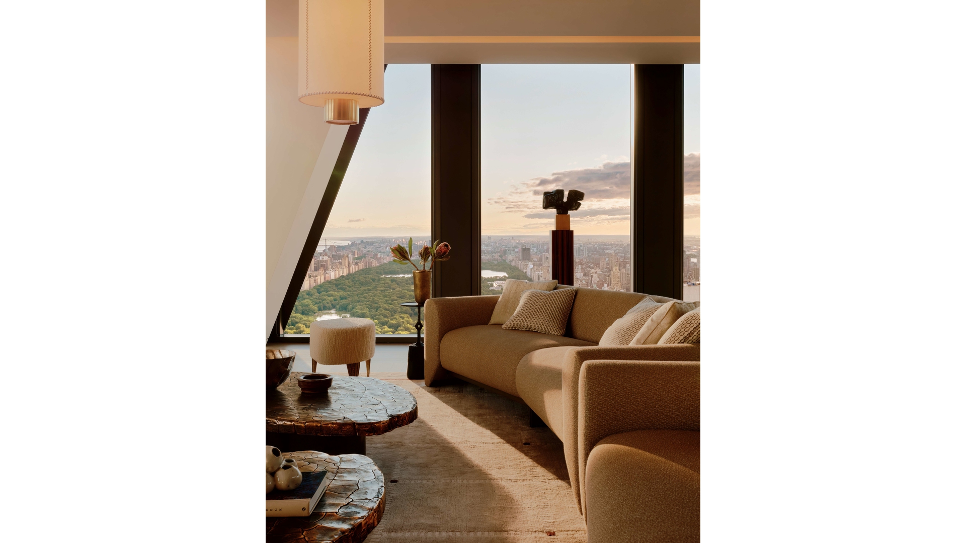 53 West 53rd Street, Unit 66 Manhattan, NY 10019 - Photo 2 of 15 a living room with furniture and a large window