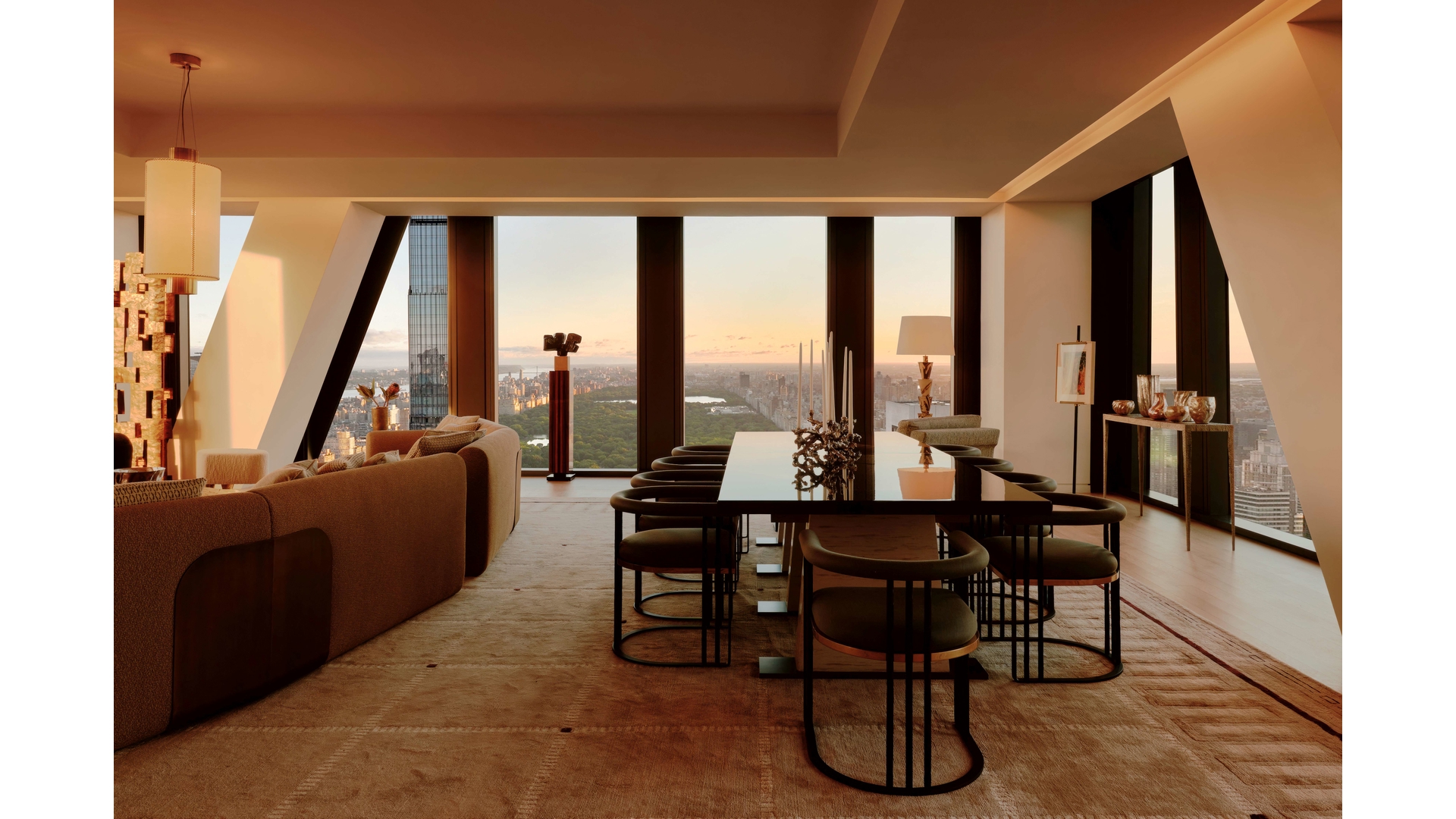 53 West 53rd Street, Unit 66 Manhattan, NY 10019 - Photo 4 of 15 a dining room with furniture and large windows