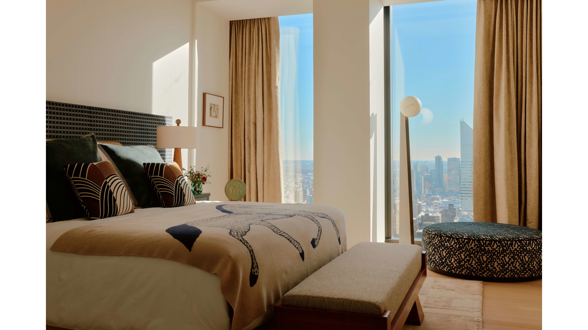 53 West 53rd Street, Unit 66 Manhattan, NY 10019 - Photo 10 of 15 a bedroom with a bed and a window