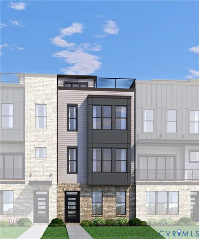 a front view of a residential apartment building with a yard