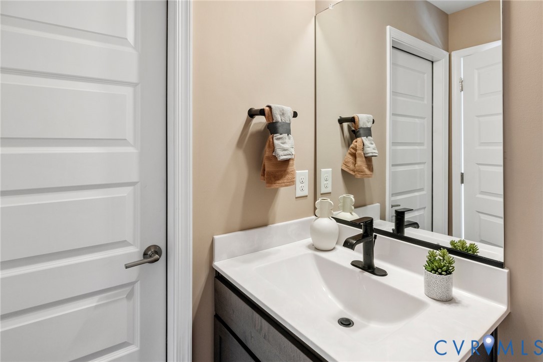 16112 Esteem Way Midlothian, VA 23113 - Photo 26 of 42 a bathroom with a sink and a mirror