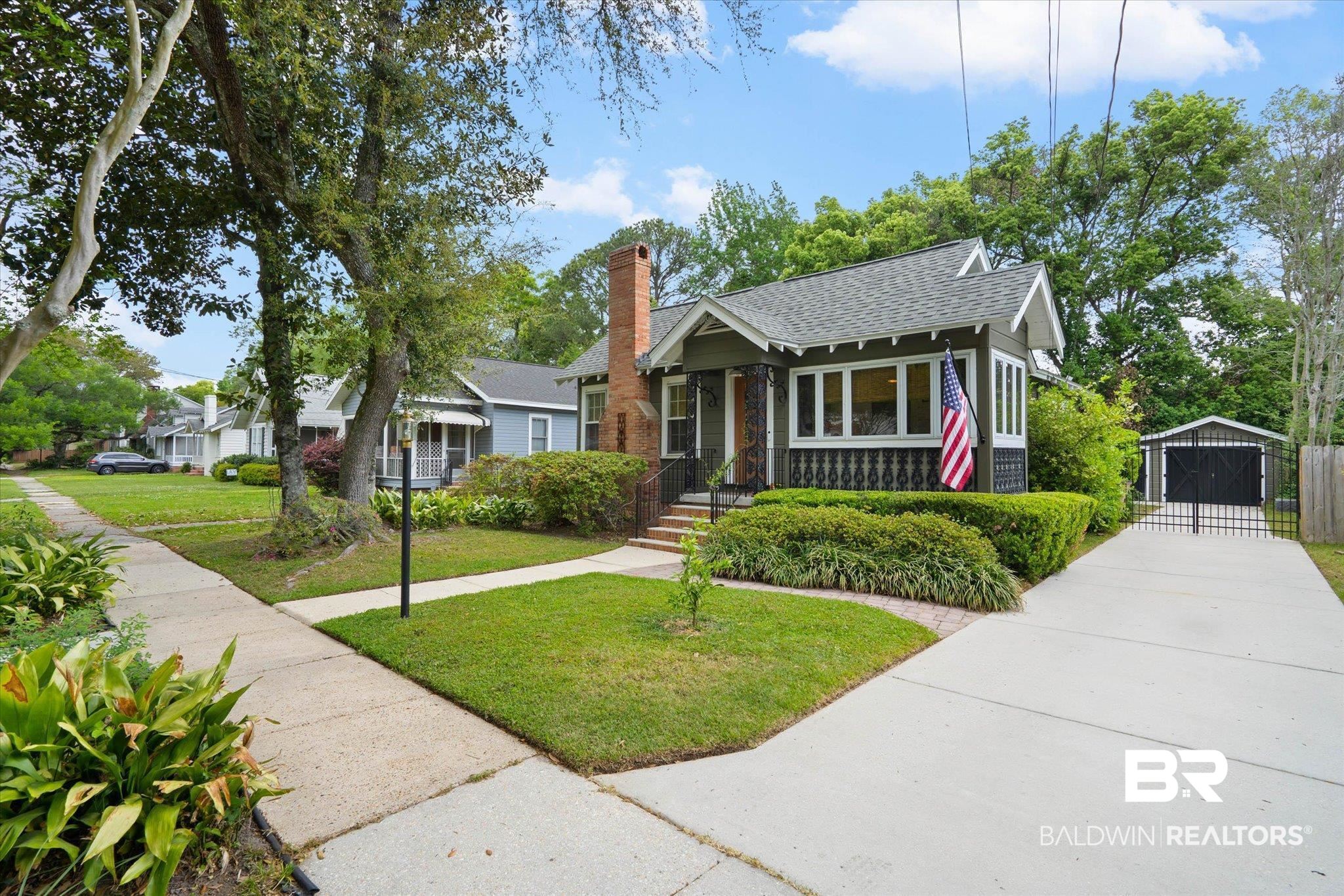 165 South Fulton Street Mobile, AL 36606 - Photo 21 of 24 Bungalow with a front lawn, a shingled roof, a chimney, and an outdoor structure